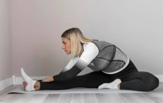 Resize Indoors Mature Woman Stretching Her Legs
