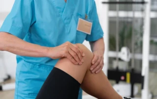 Resize Medical Assistant Helping Patient With Physiotherapy Exercises