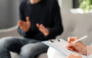 Resize Mid Shot Worried Man With Mask Talking Counselor