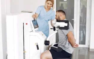 Resize Patient Doing Exercise Using Sports Equipment With Therapist