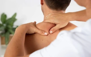 Resize Physiotherapist Performing Therapeutic Massage Male Client