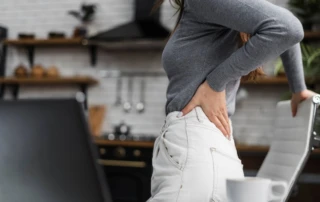 Resize Side View Woman Having Backache While Working From Home