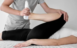 Resize Therapist Undergoing Physical Therapy With Female Patient