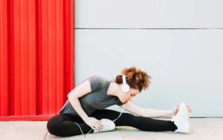 Resize Woman Enjoying Music Stretching