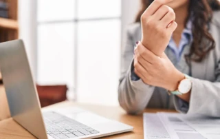 Resize Young Hispanic Woman Business Worker Suffering Wrist Pain Office